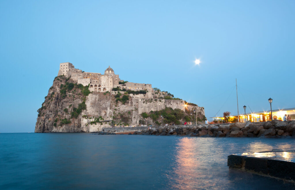 Aragonese Castle by night in Ischia island, Italy